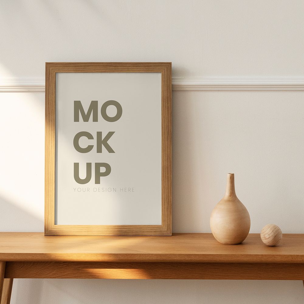 Wooden picture frame mockup on a wooden sideboard table