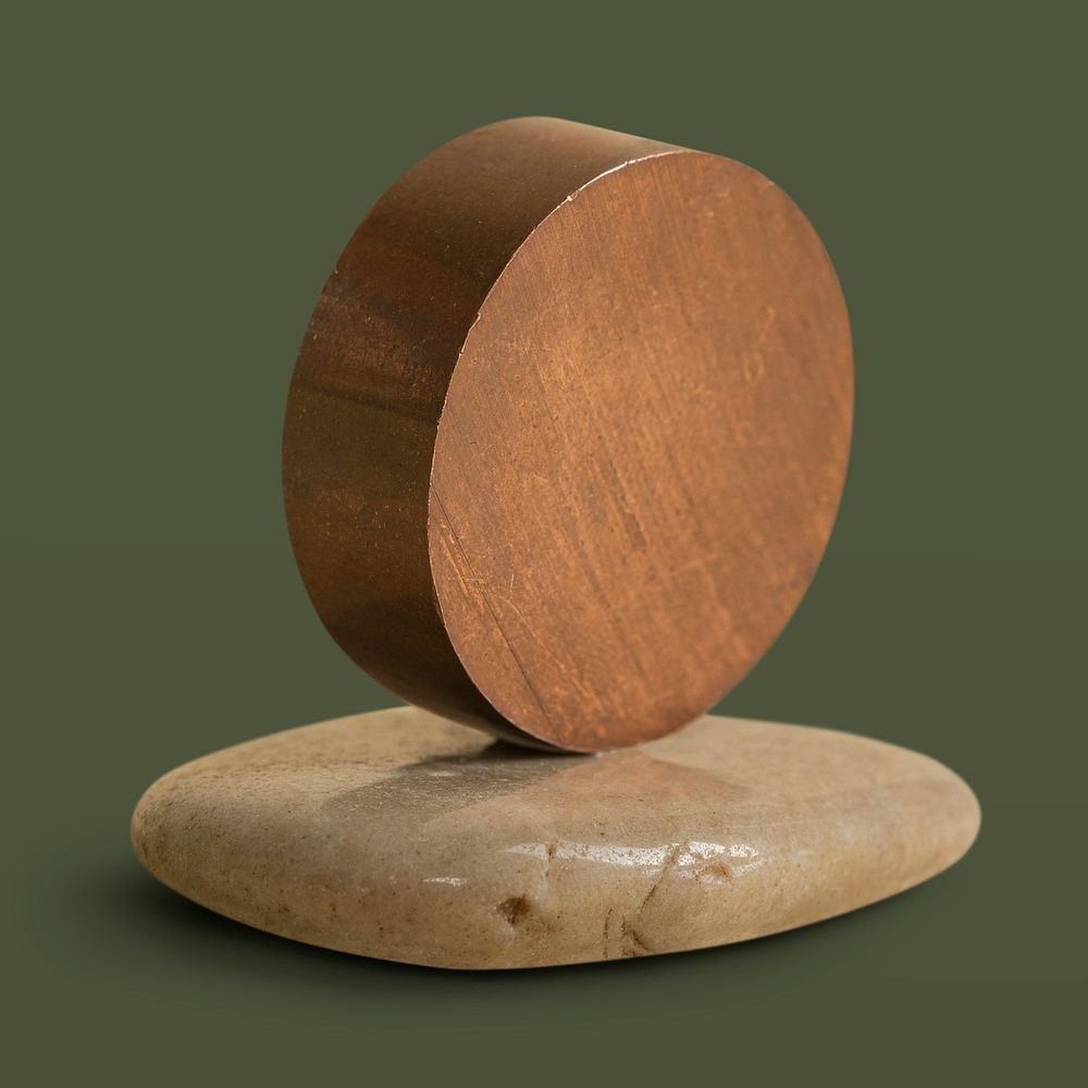 Round wooden home decor on a stone