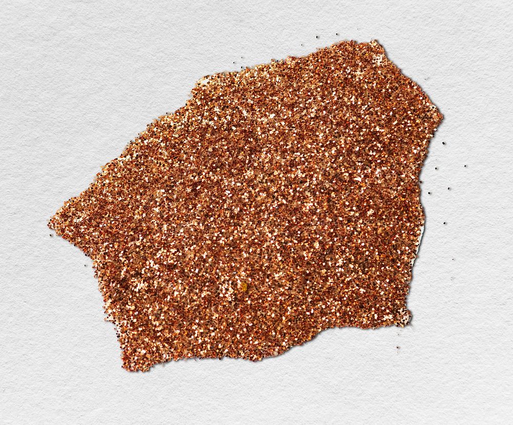 Shimmery bronze glitter on a piece of paper