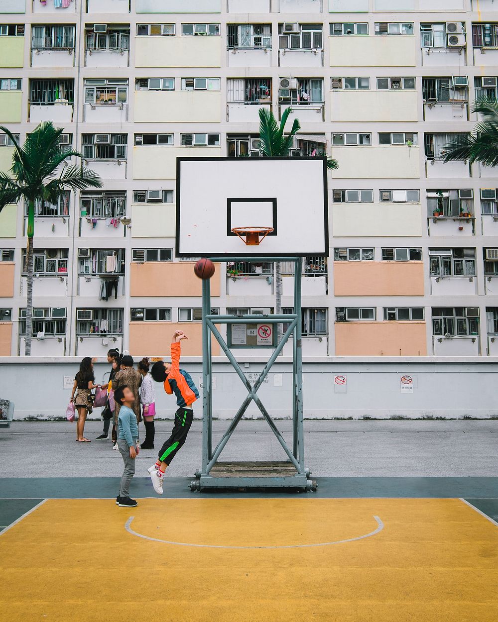 Young boy shooting a basketball into a hoop. 10 MARCH, 2019 - HONG KONG