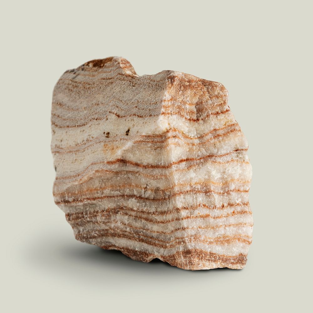 Natural layered marble rock on beige background