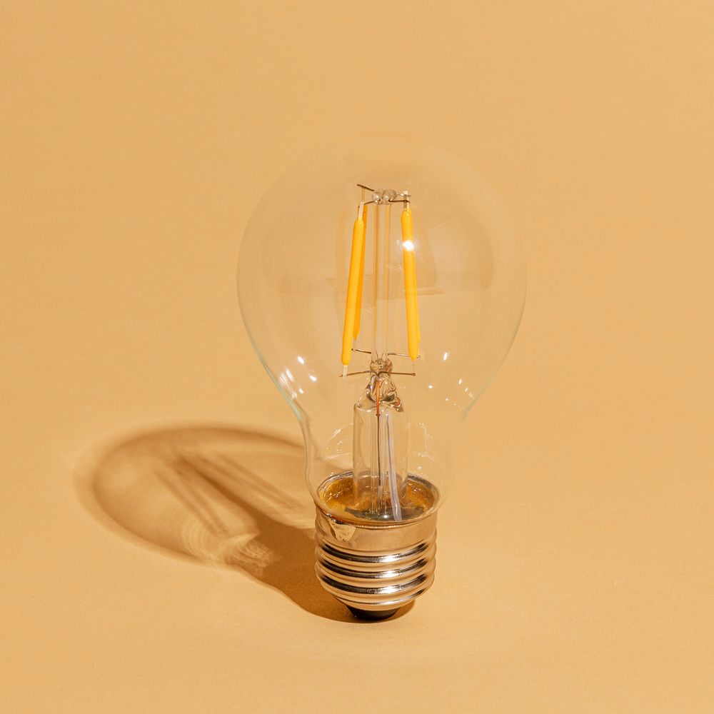 Edison light bulb on a brown background