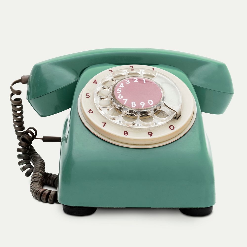 Vintage green telephone on white background