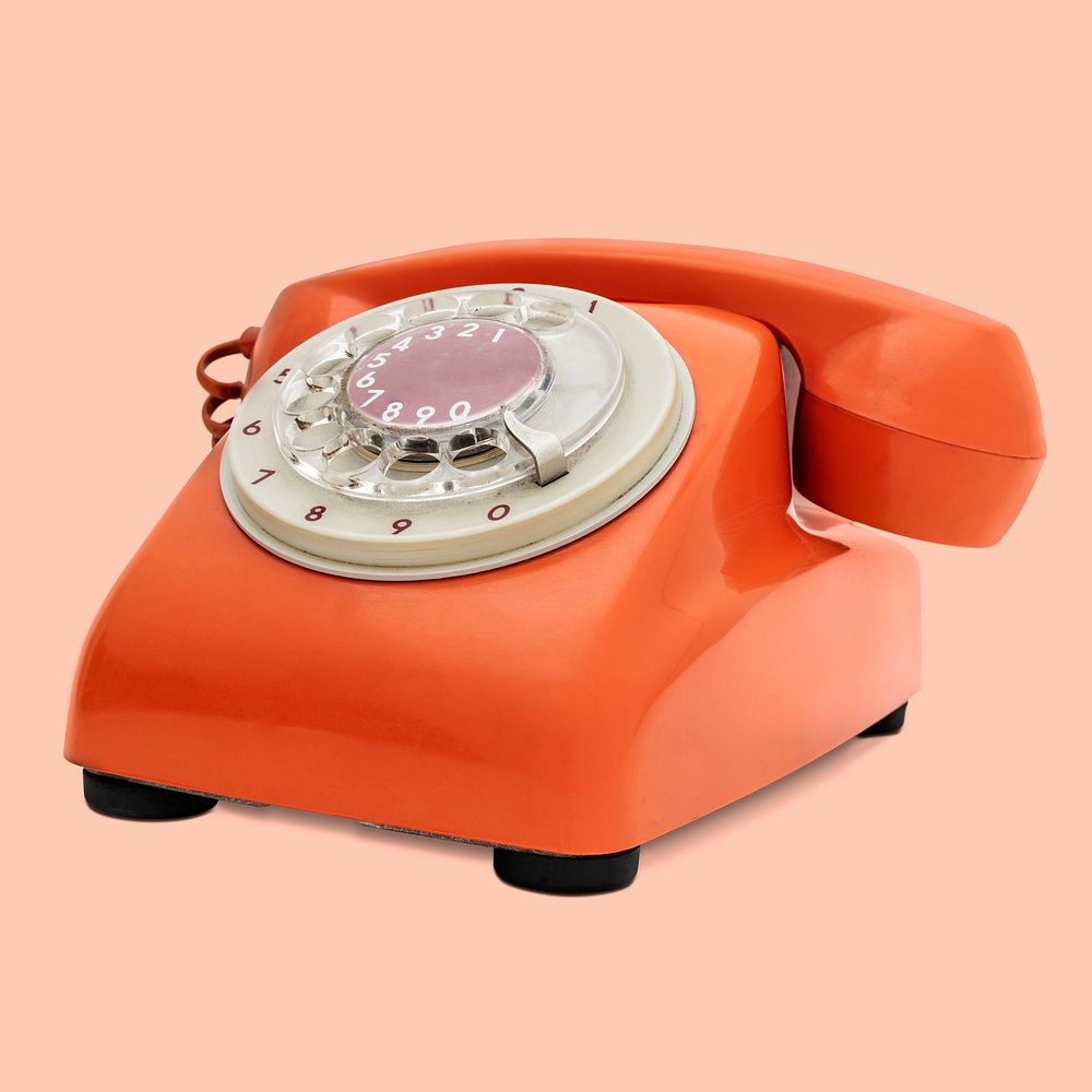 Vintage orange telephone on orange background