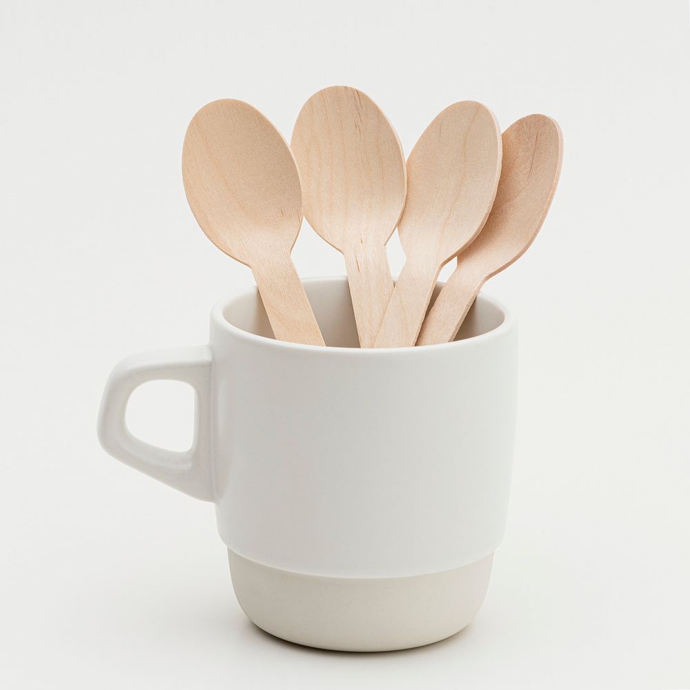 Wooden spoons in a white cup
