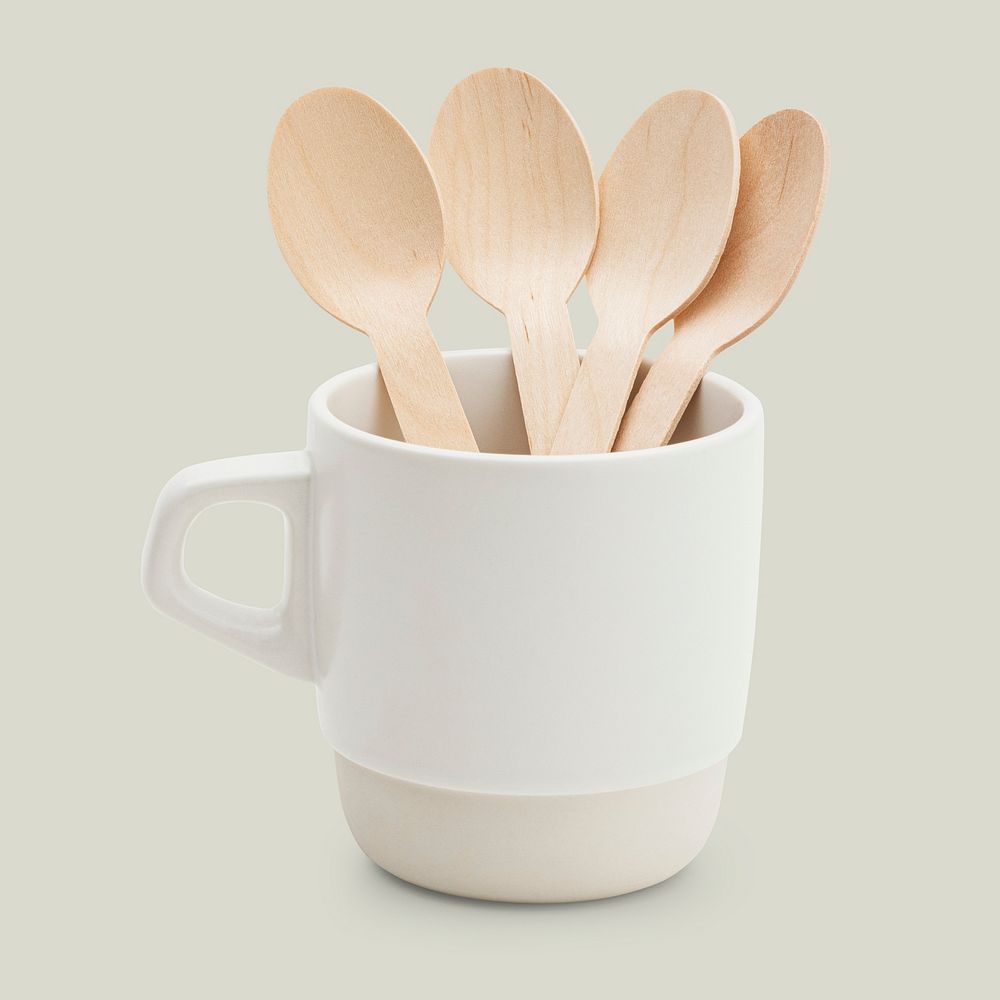Wooden spoons in a white cup