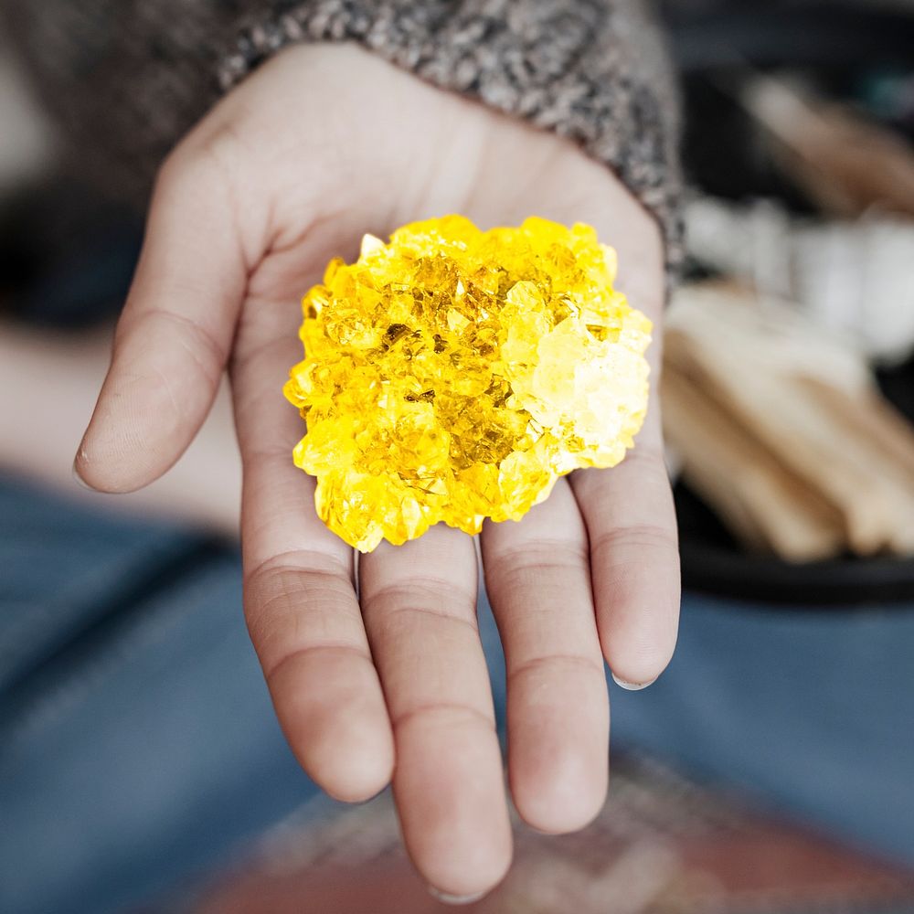 Woman using a citrine healing crystal 
