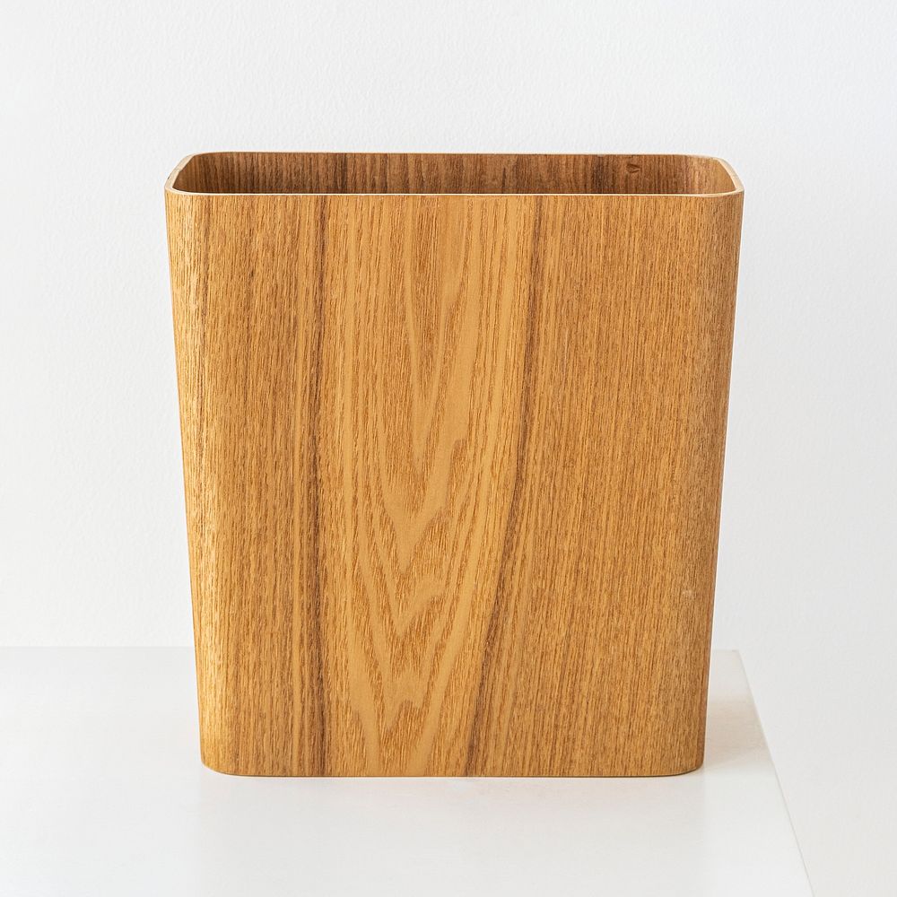Wooden rectangular dustbin on off white background