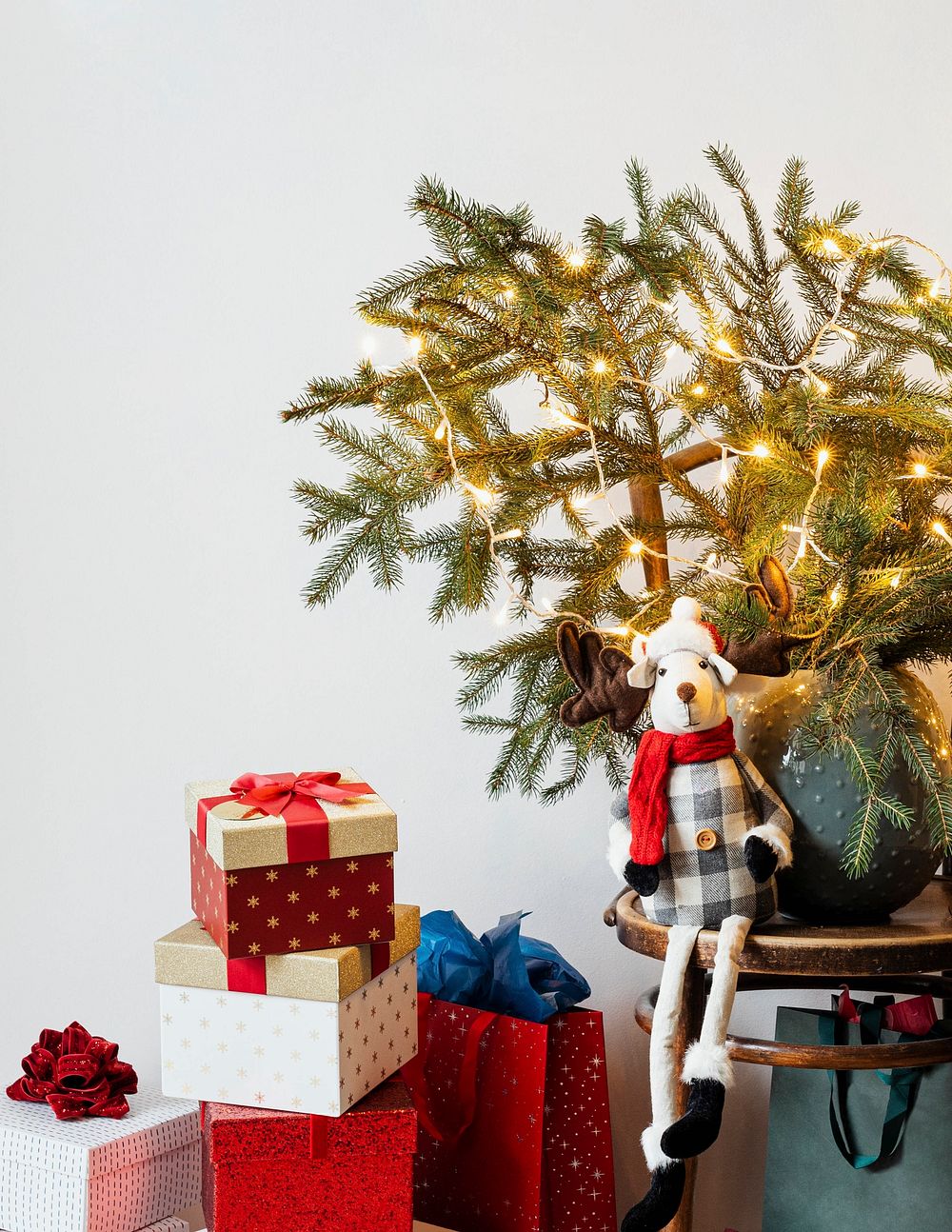 Festive presents under a minimal Christmas tree flyer background 