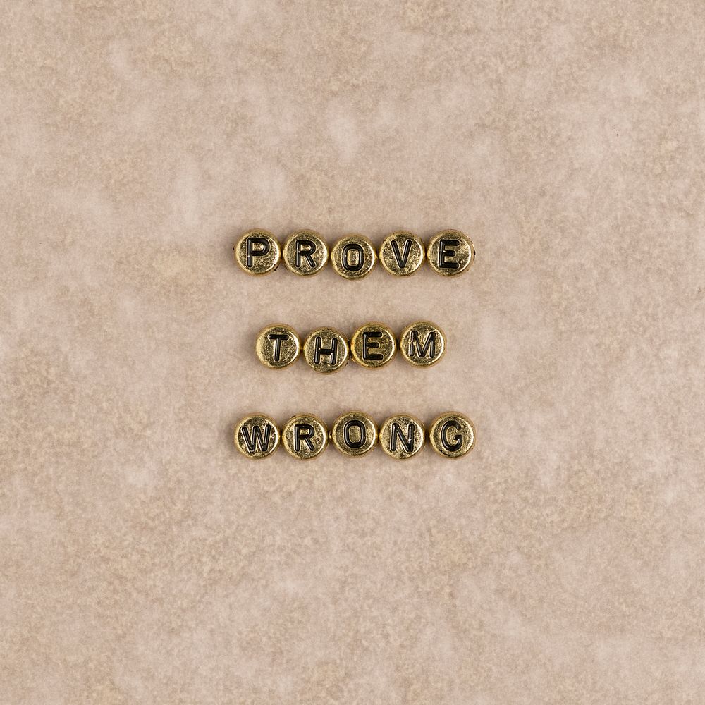 PROVE THEM WRONG beads text typography