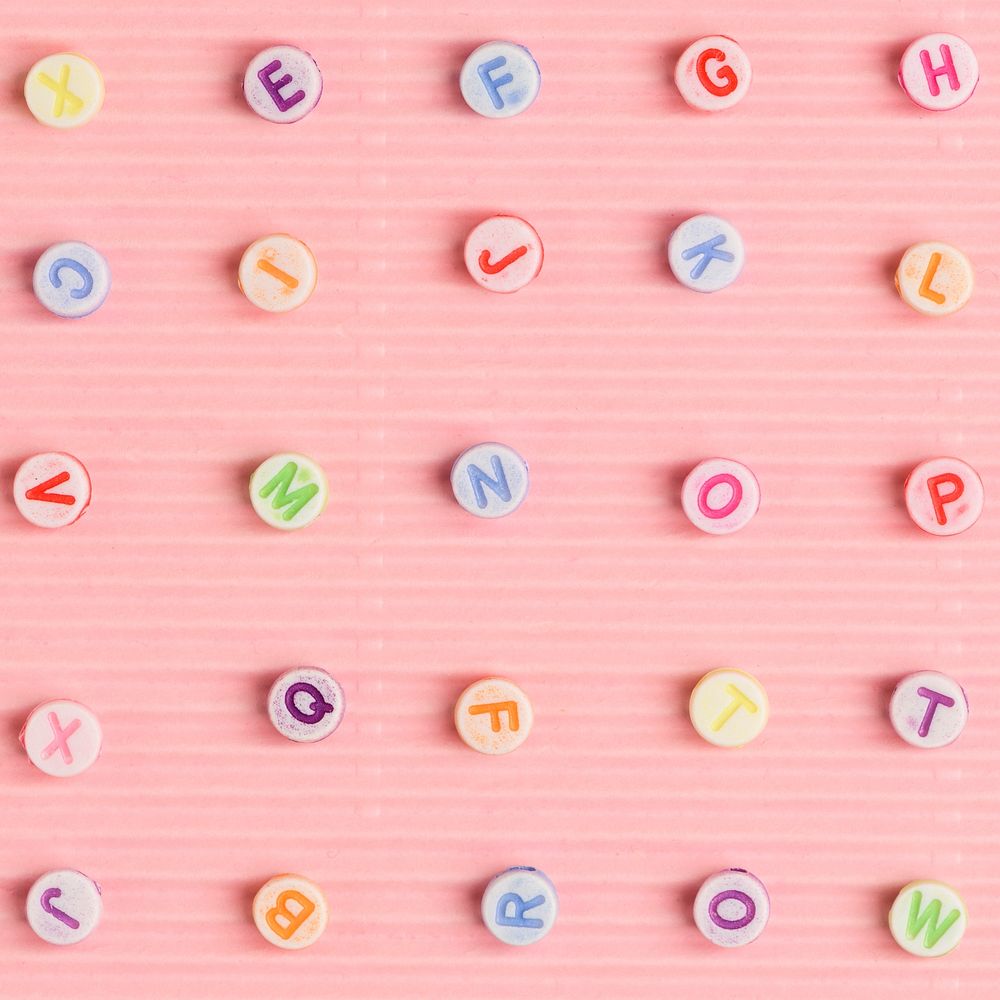 Alphabet beads pattern pink wallpaper background