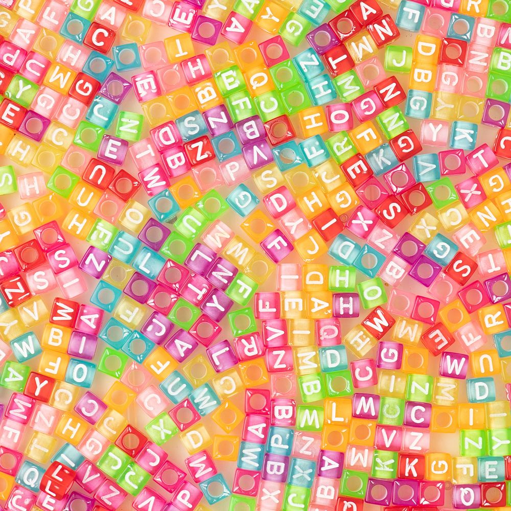 Colorful English alphabet beads background