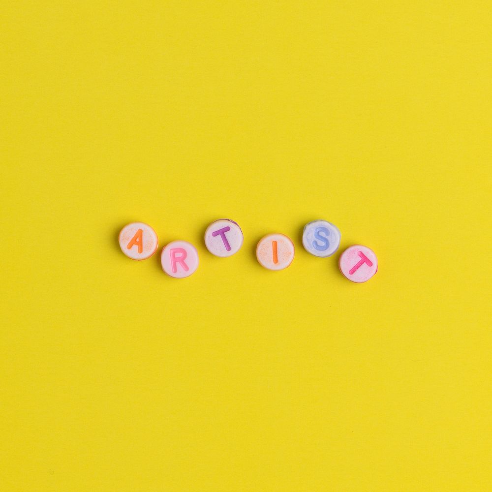 ARTIST beads text typography on yellow