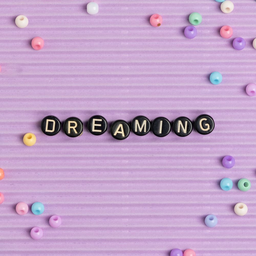 DREAMING beads text typography on purple