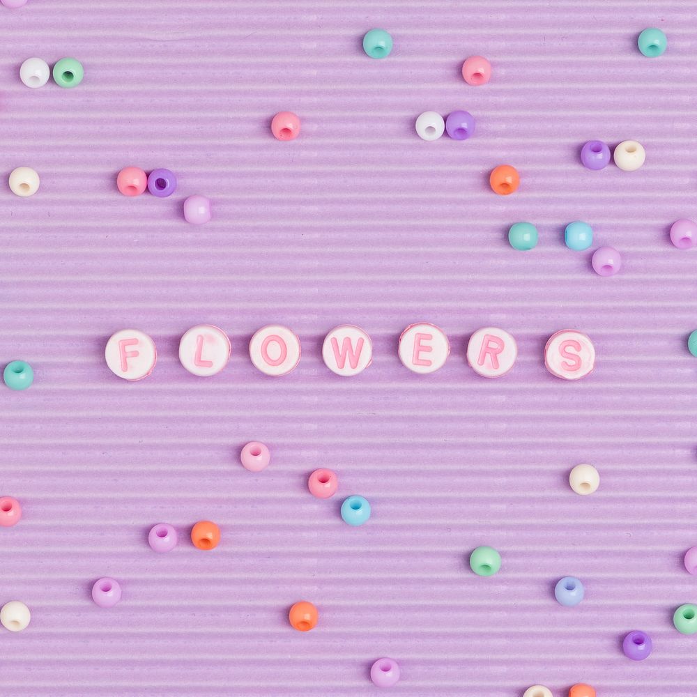 Flowers typography beads letter purple background