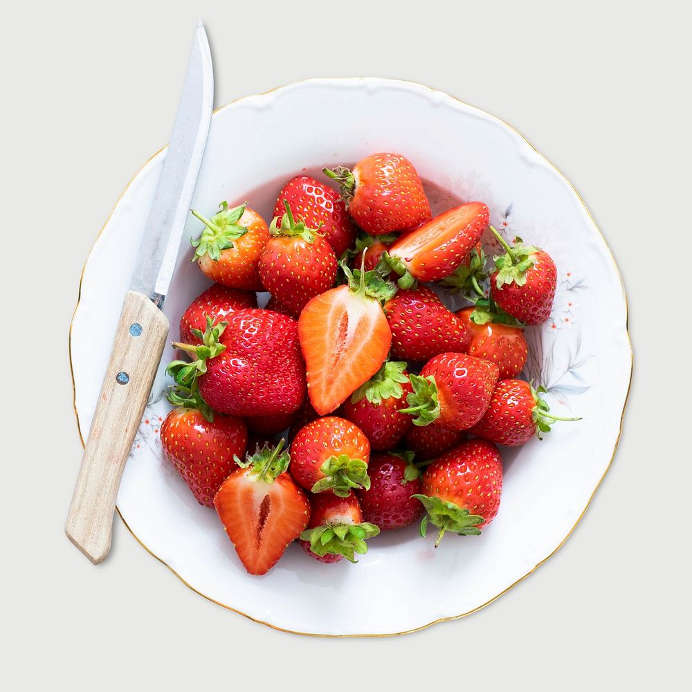 Psd strawberry in white plate with knife 