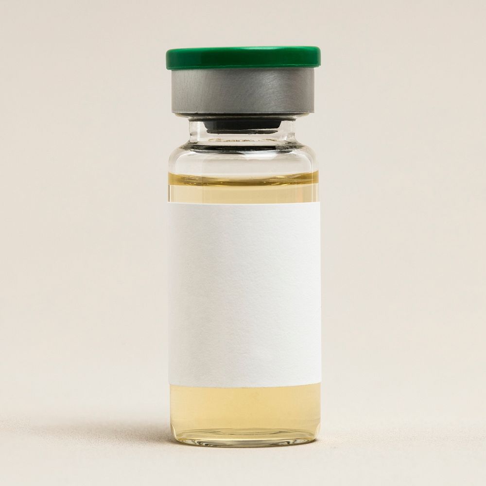 Blank vaccine label on injection glass bottle with yellow liquid