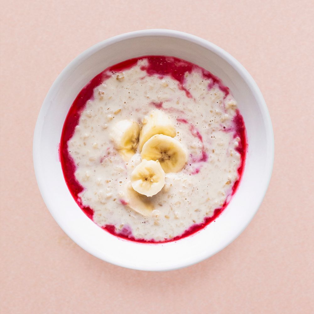 Banana porridge, raspberry sauce, healthy breakfast