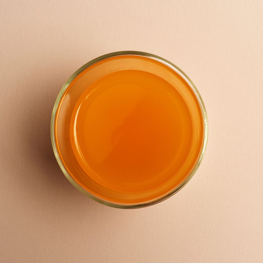 Aerial view of glass of fresh organic orange juice