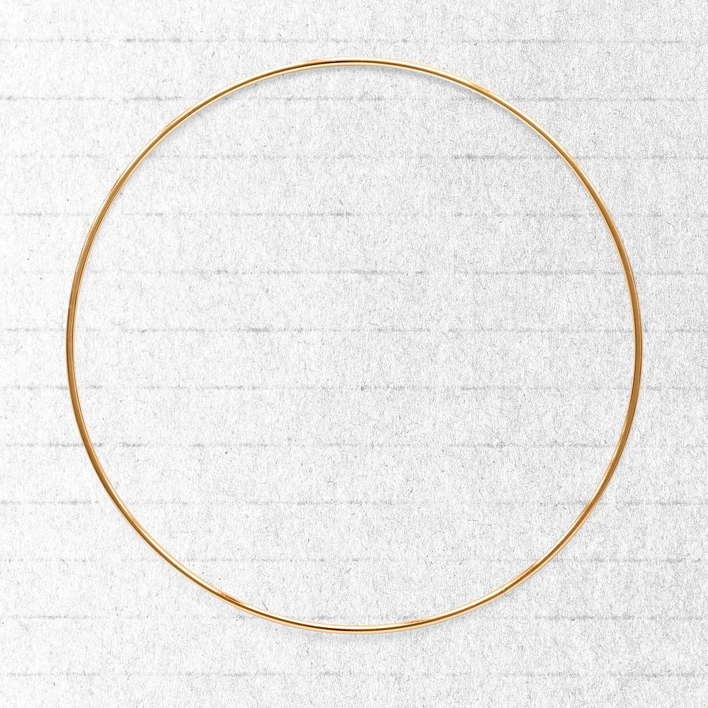 Round  gold frame on a white paper textured background