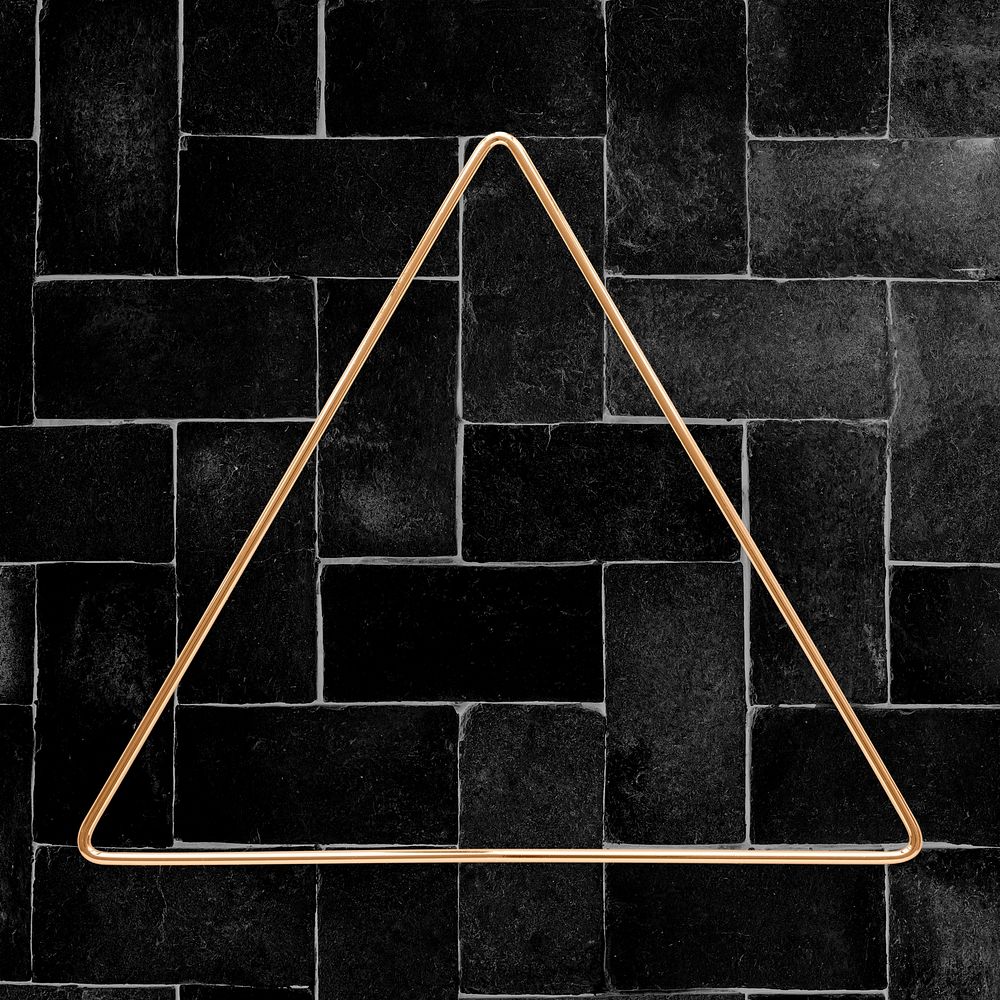 Triangle gold frame on a black brick patterned background