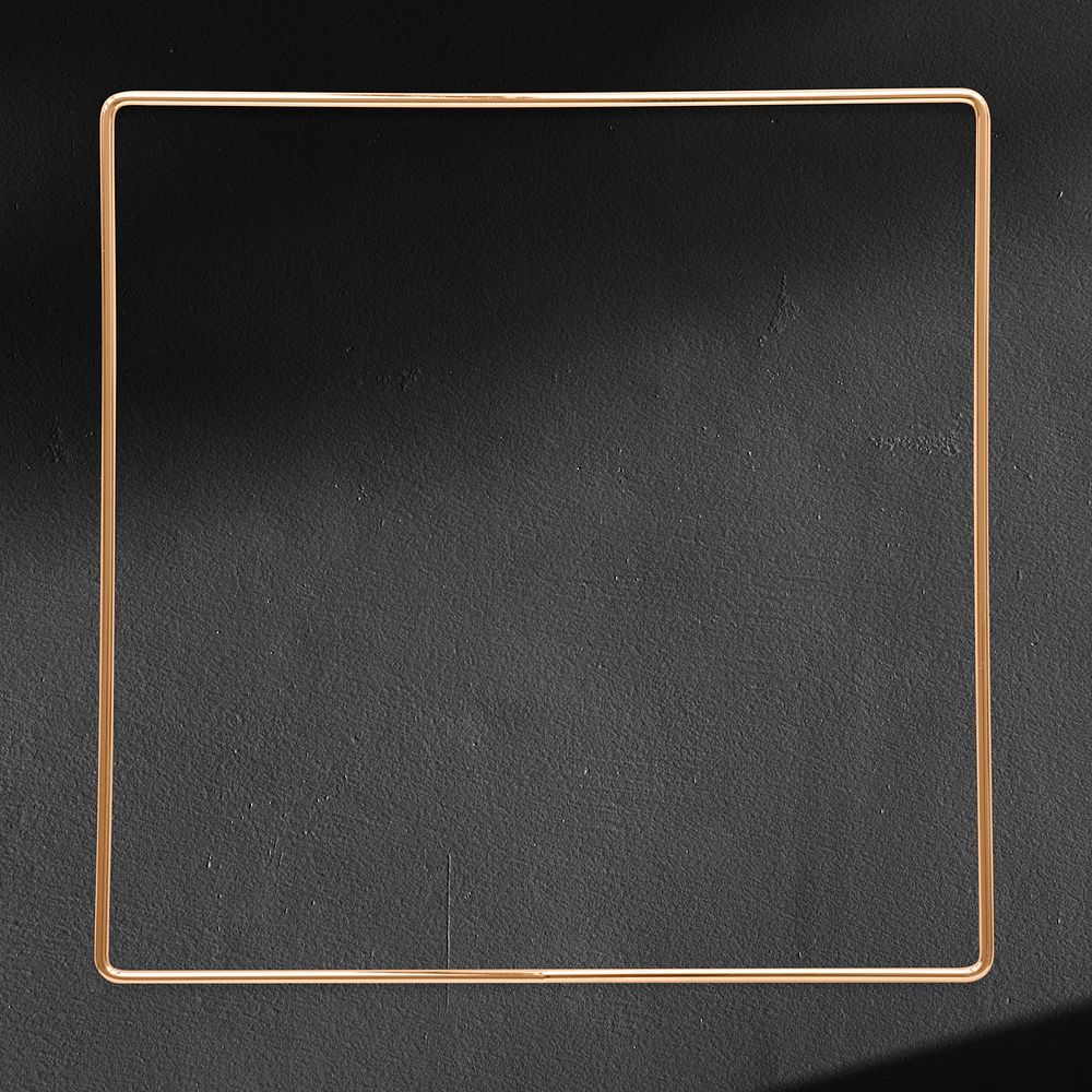 Square gold frame on a black textured background