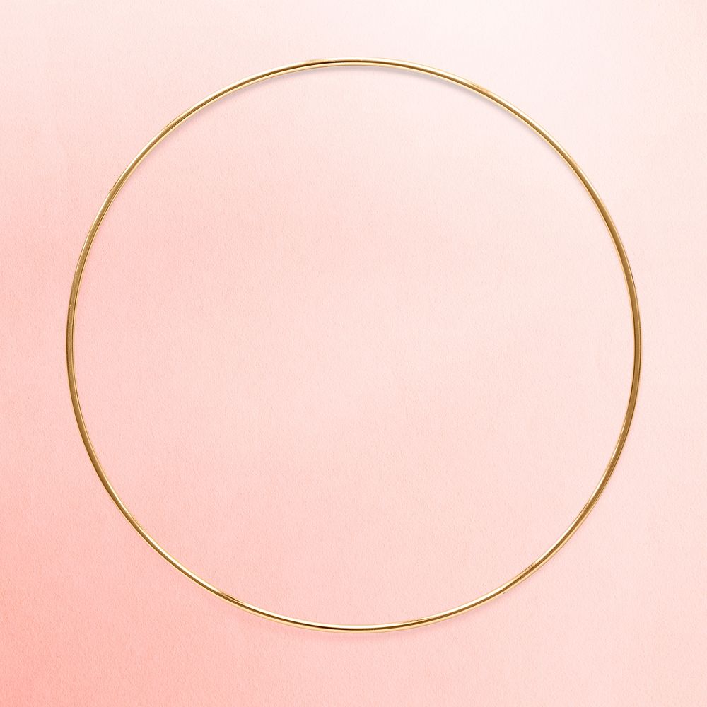 Round gold frame on an old rose pink background