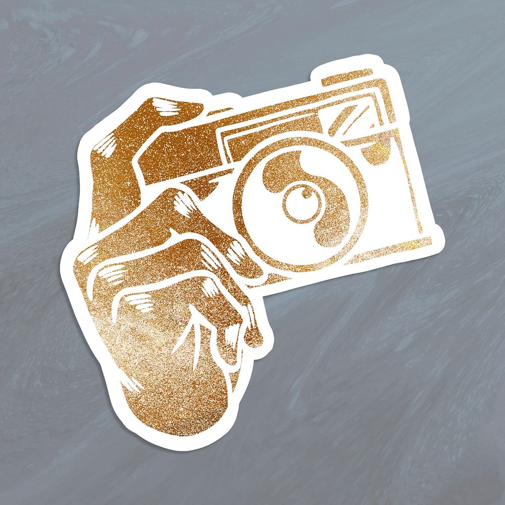 Shimmering golden analog camera sticker overlay on a gray background 