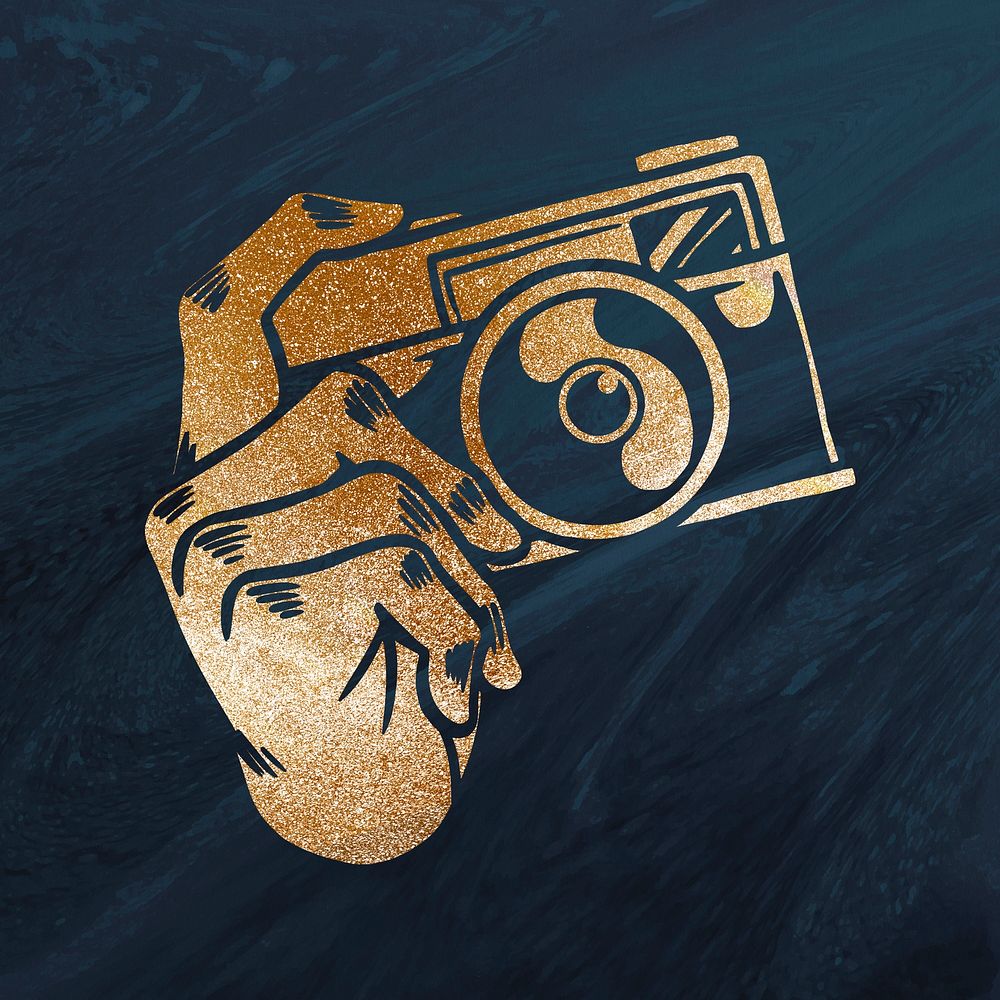Shimmering golden analog camera sticker overlay on a navy blue background 
