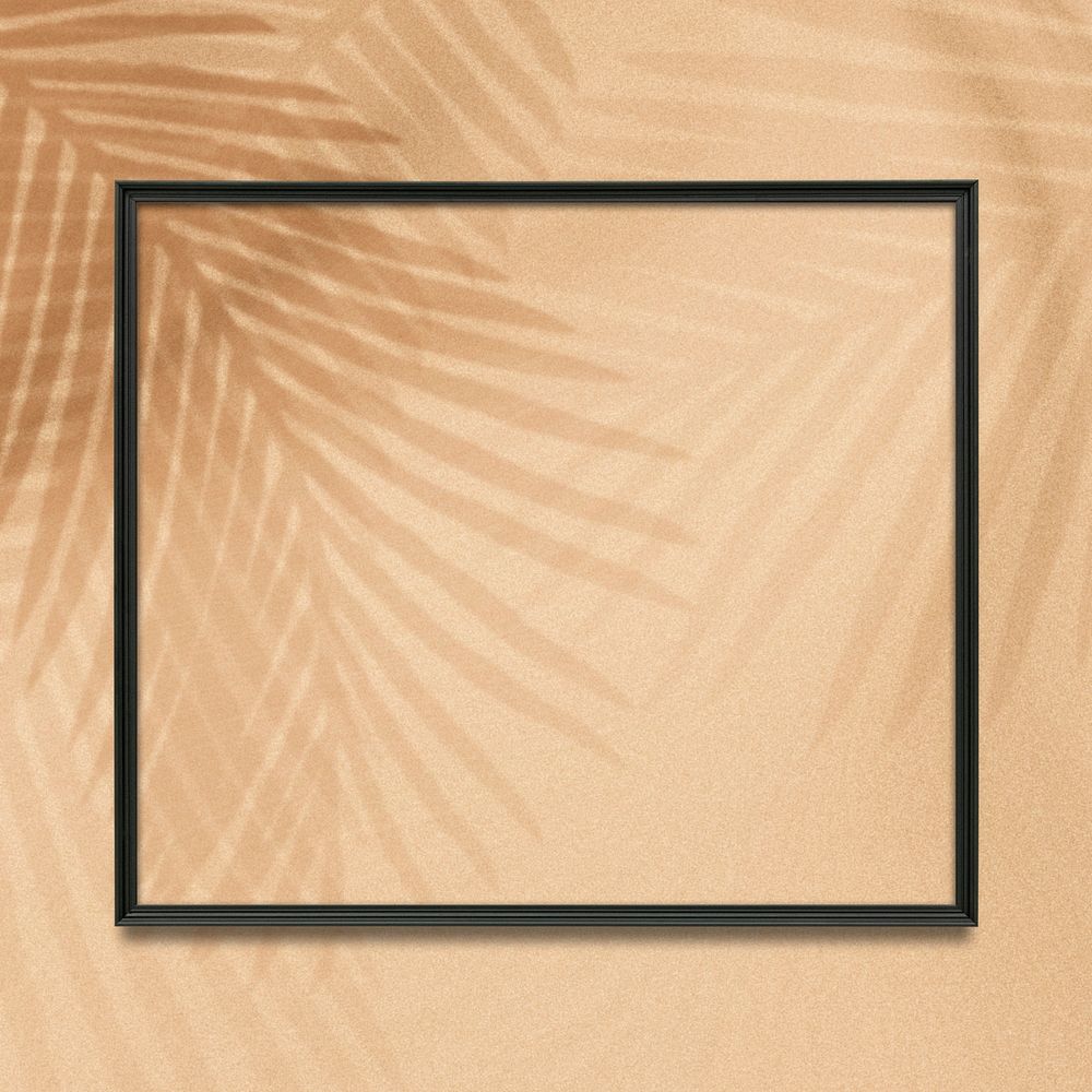 Black square frame on a tropical palm leaves background 