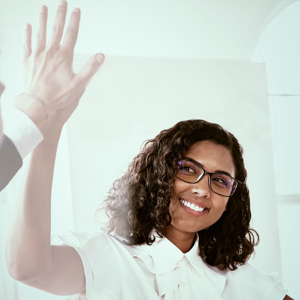 Businesswoman giving high five with colleague