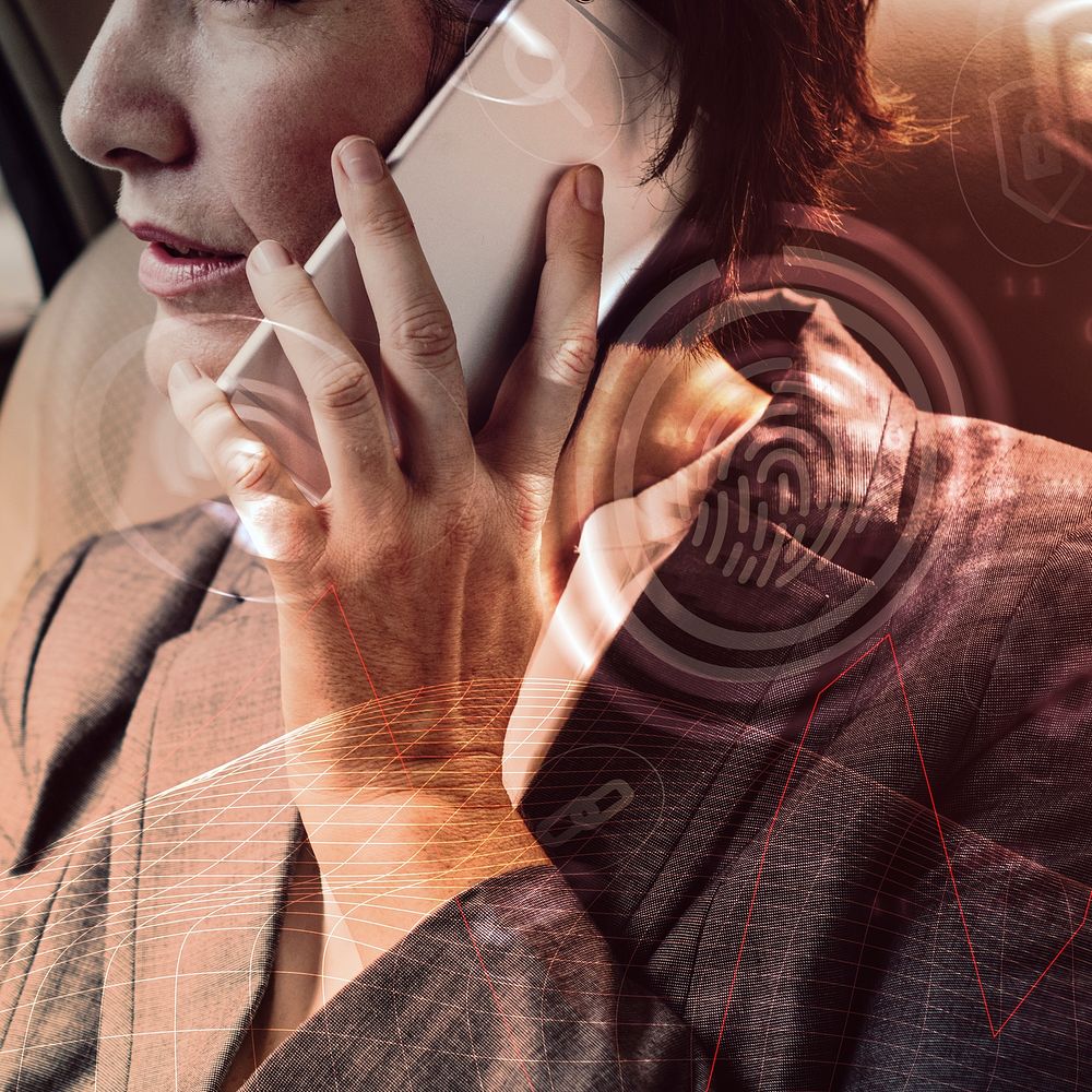 Business person holding smartphone in car