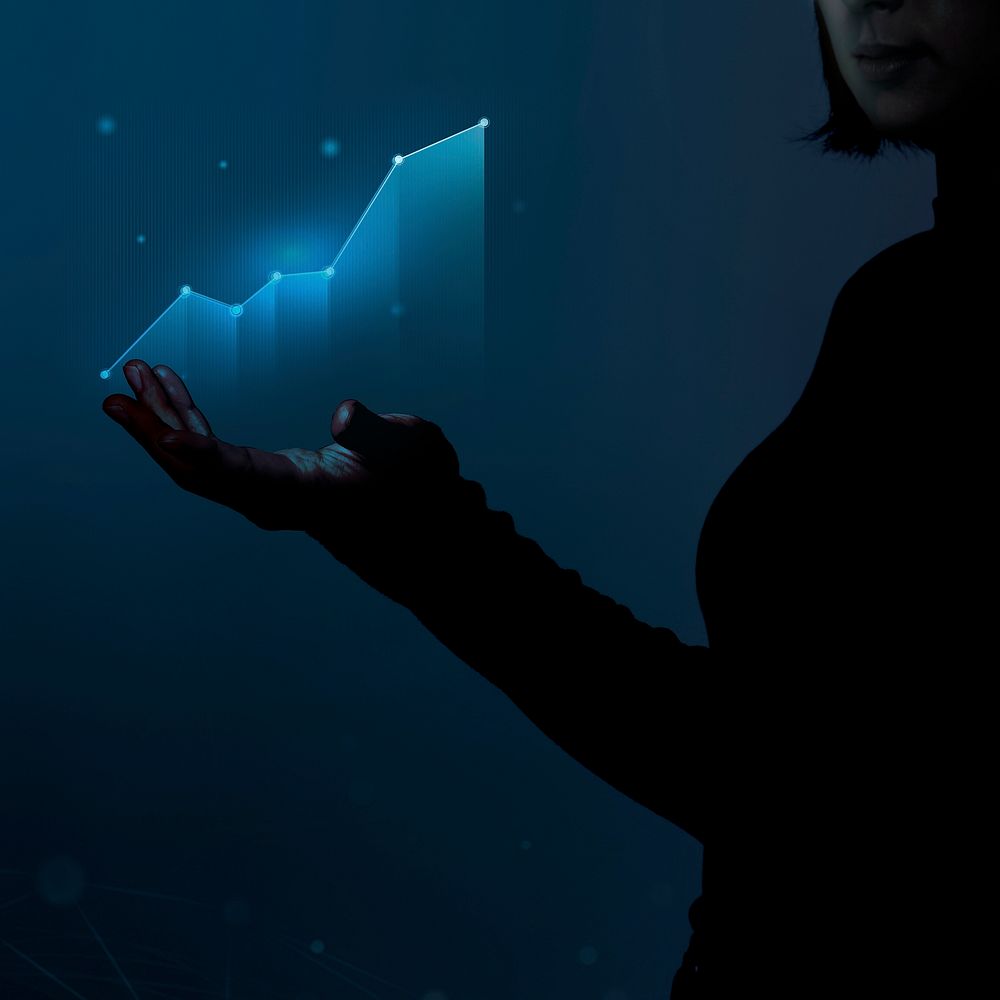 Businesswoman holding a digitally generated graph