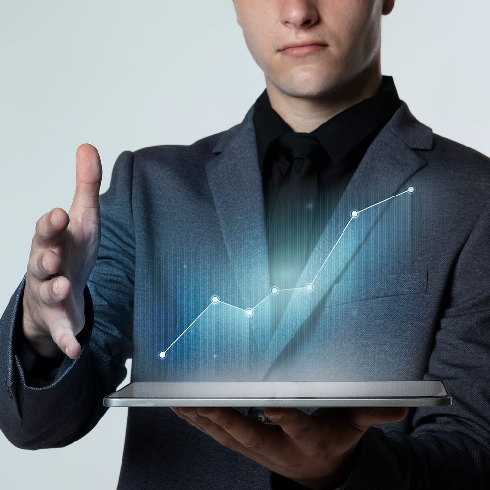 Businessman presenting graph data and stats with a high technology digital tablet