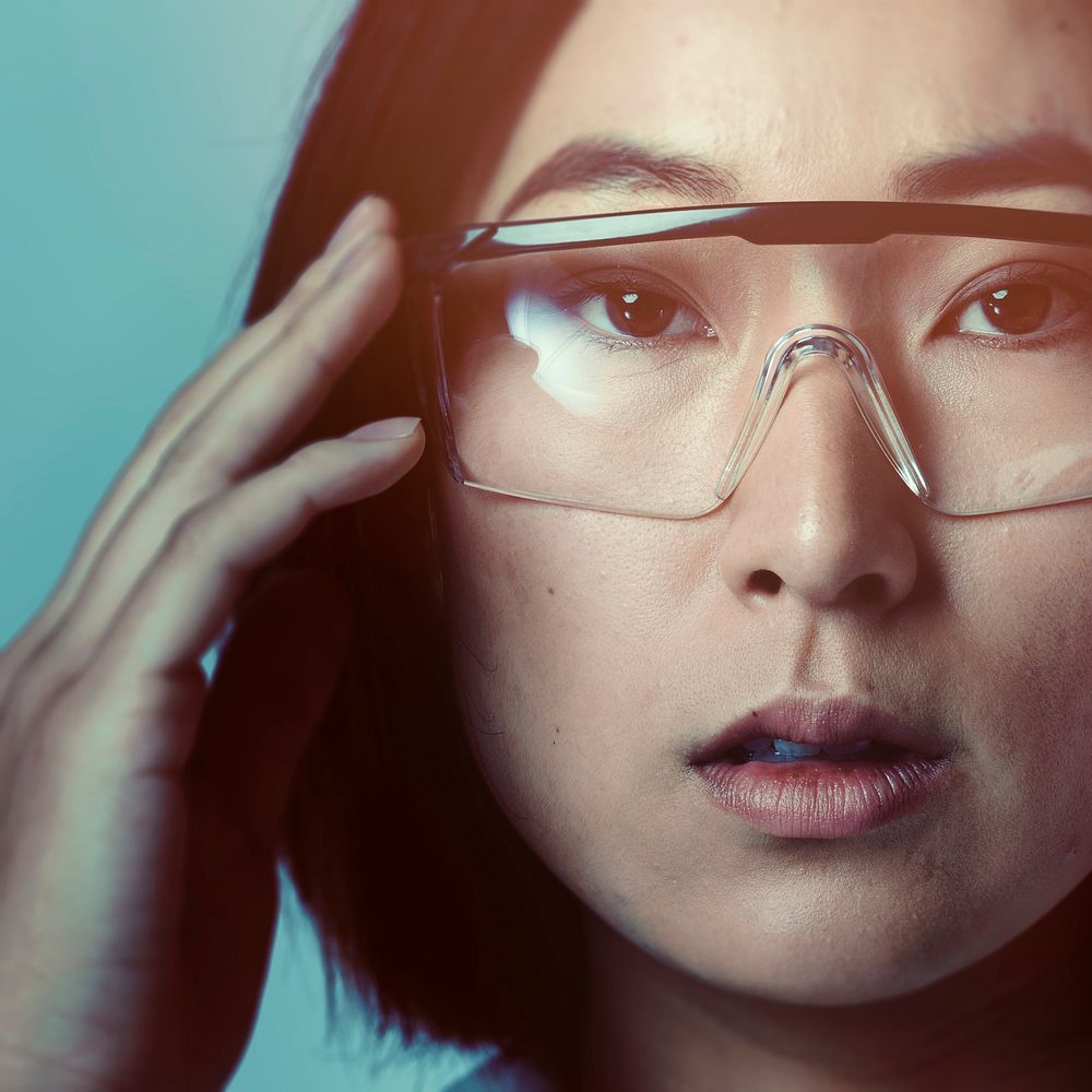 Woman touching AR smart glasses futuristic technology