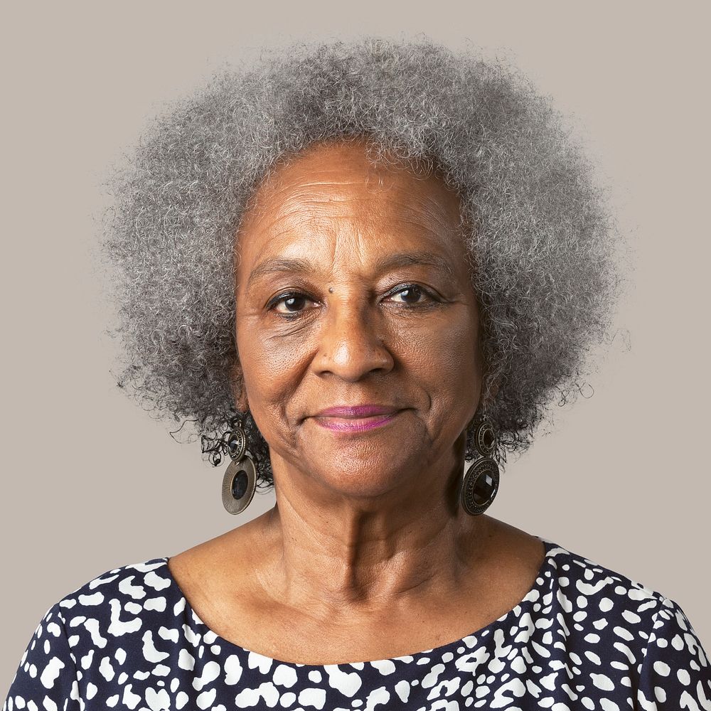 Elderly woman smiling face closeup portrait on brown background