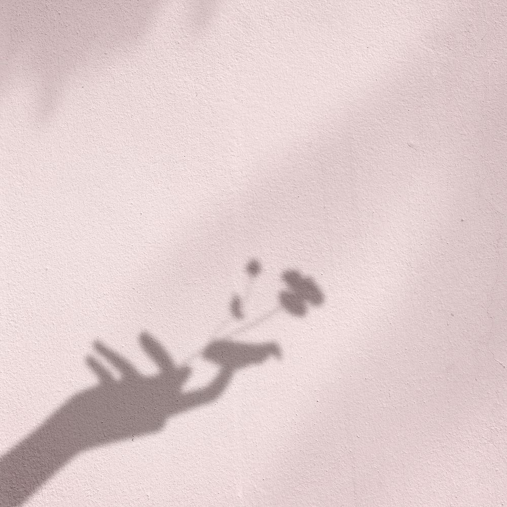 Background with flower in hand shadow
