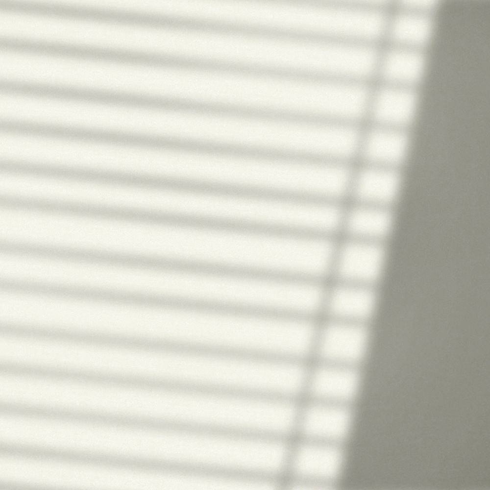 Background with window blind shadow during golden hour