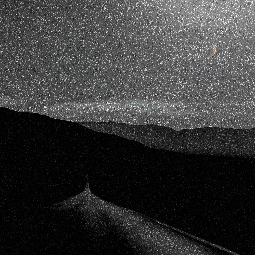 Creative background of mountain range with sky full of stars and crescent moon in black and white