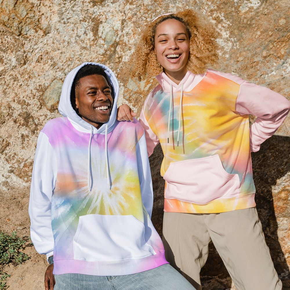 Happy couple in colorful tie dye hoodies