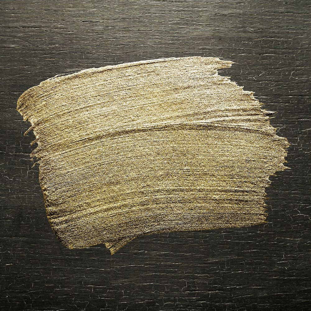 Gold oil paint brush stroke texture on a colored wood background