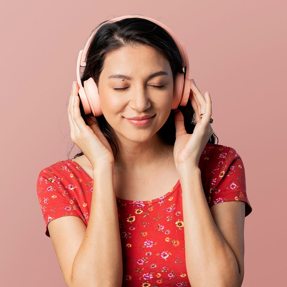 Cheerful woman listening to music with a headset