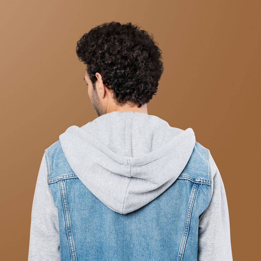 Rear view of man in a half denim hoodie jacket