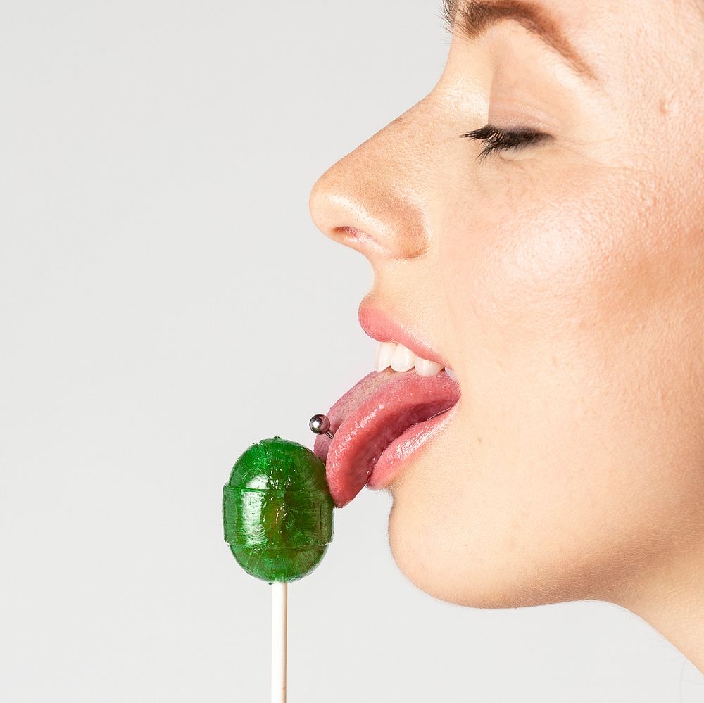 Beautiful woman enjoying a lollipop