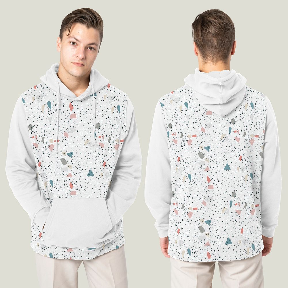 Handsome man wearing printed hoodie for winter fashion studio shoot rear view