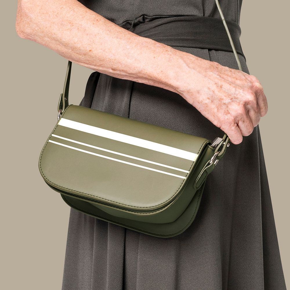 Women&rsquo;s green leather crossbody bag with stripes close up