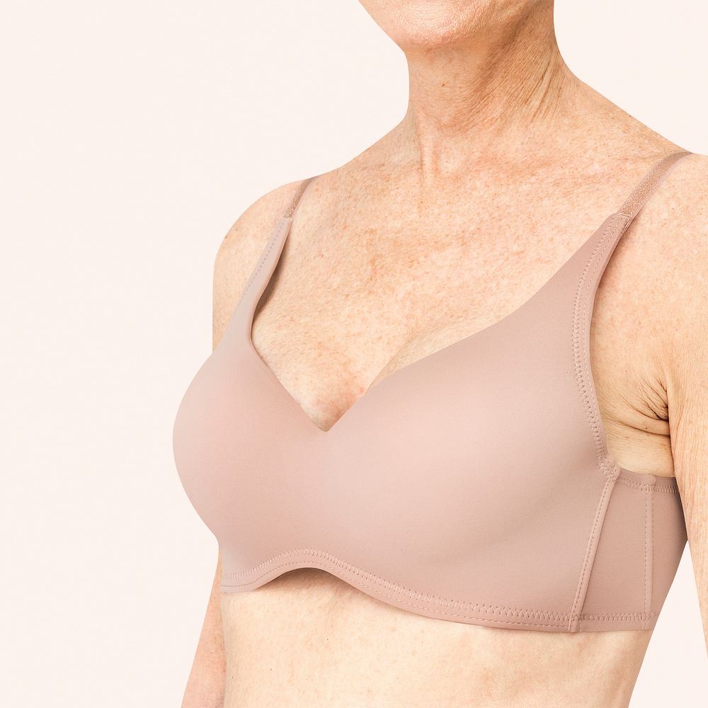 Senior woman in nude bra with design space