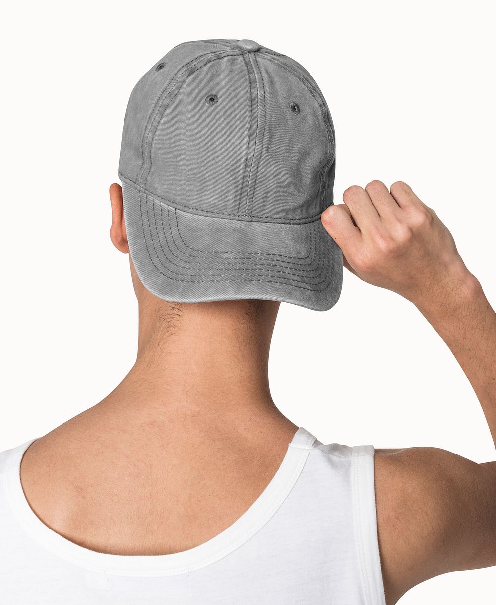 Teenage boy in gray cap studio candid for street fashion shoot
