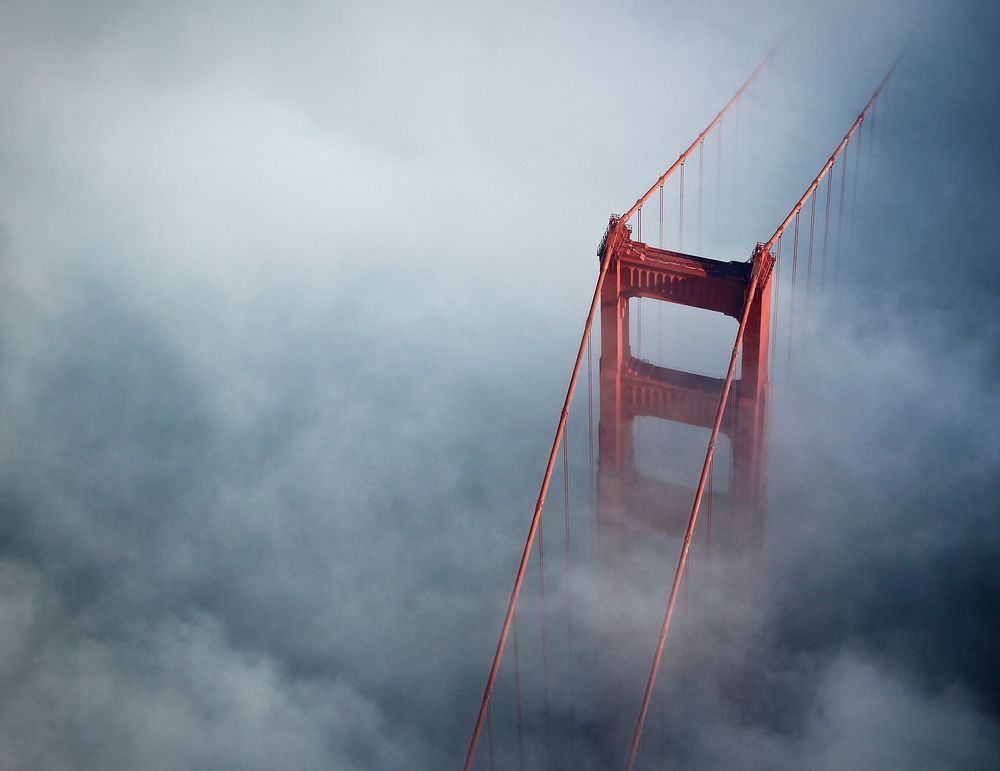 Aerial view of Golden Gate Bridge on a foggy day. Original public domain image from Wikimedia Commons