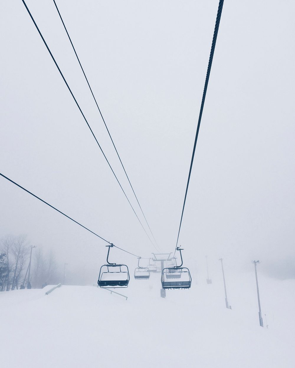 Foggy chairlift at Mont-Tremblant, Québec, Canada.. Original public domain image from Wikimedia Commons